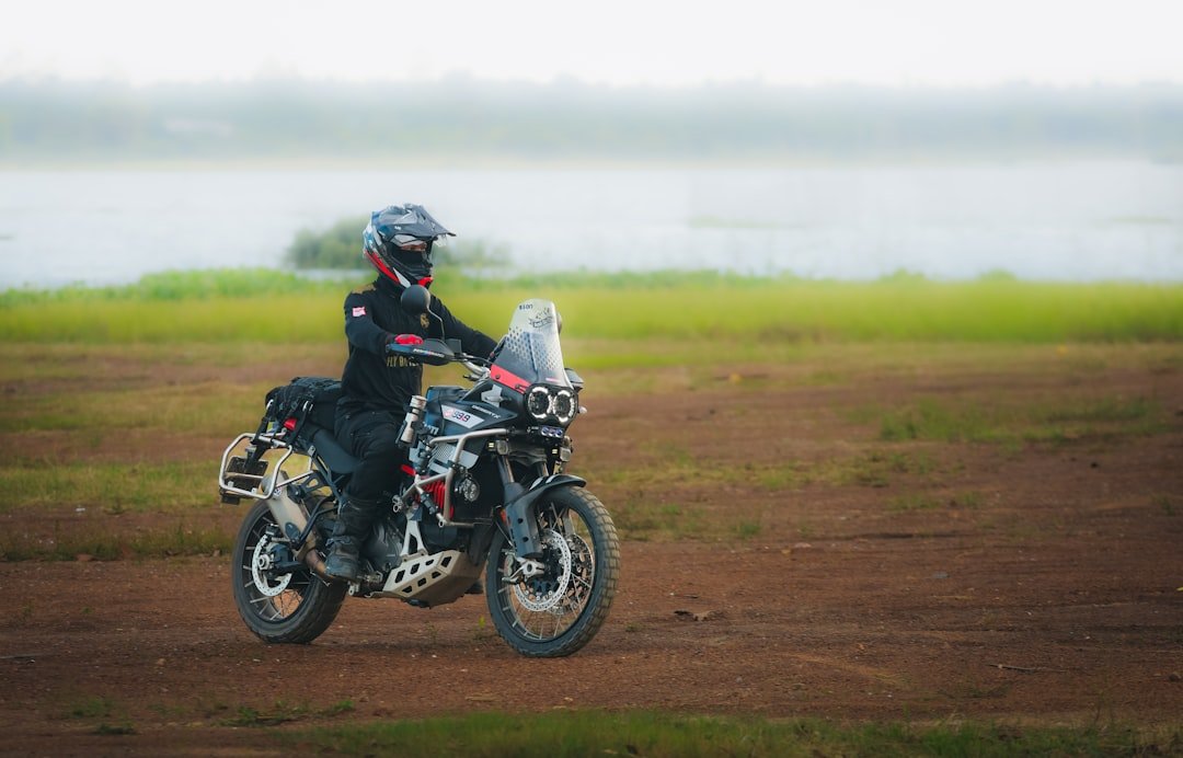 Rider on a motorcycle on a dirt road.
