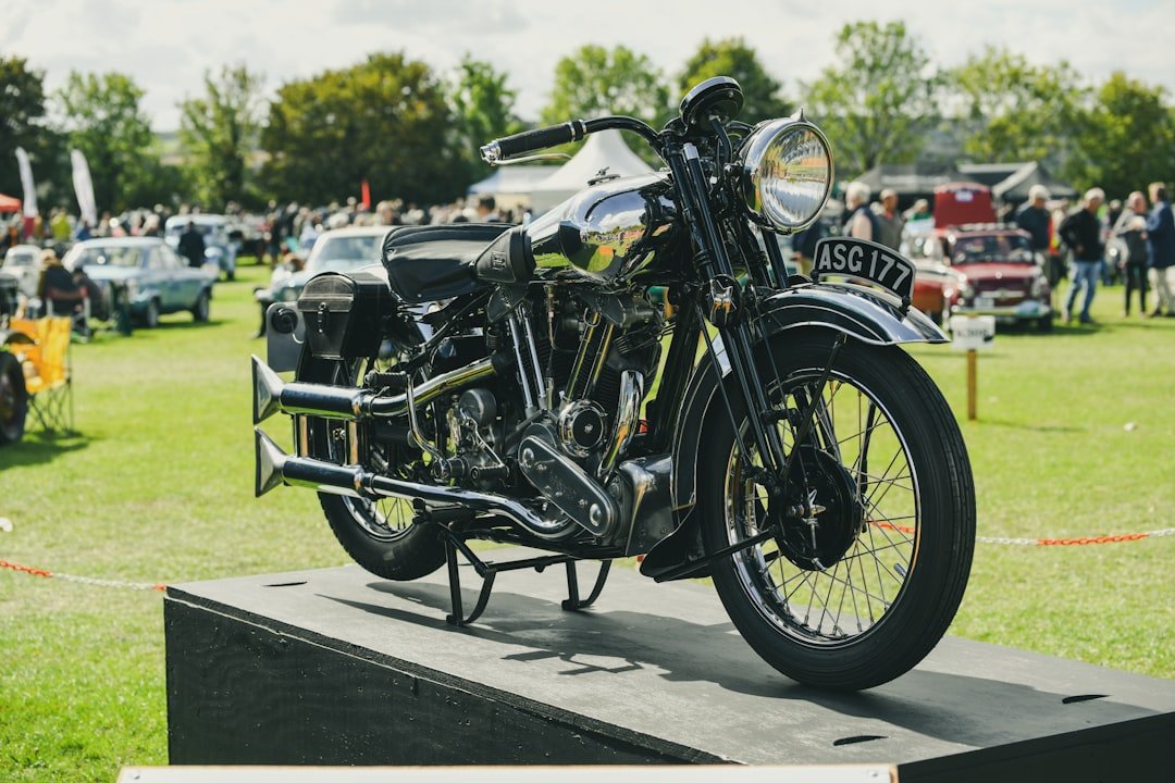 Vintage motorcycle displayed outdoors at an event.