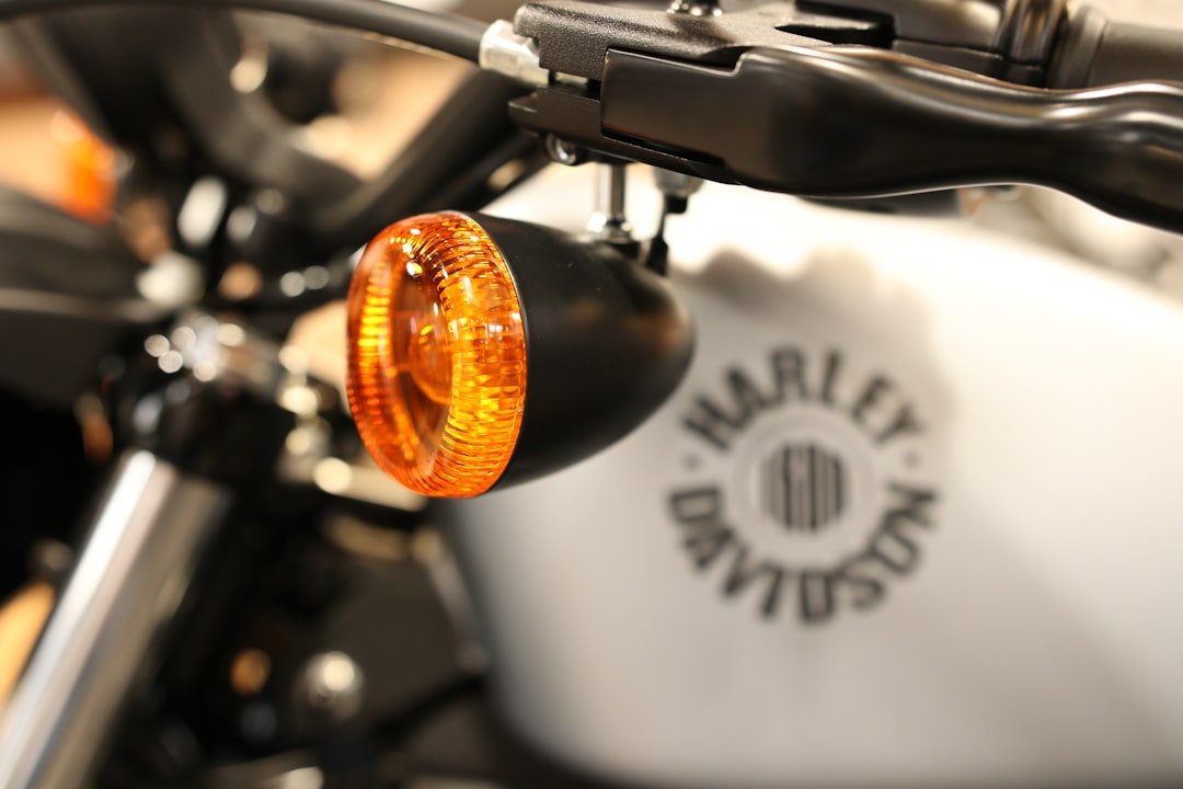 A close up of a motorcycle with a light on