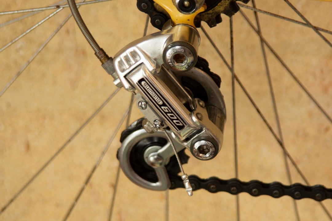 gray stainless steel and black bike wheel