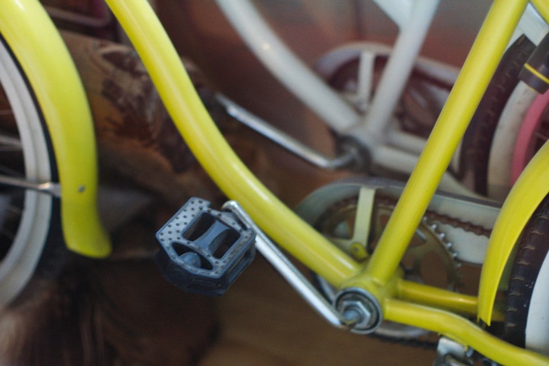 a close up of a yellow bicycle handlebars