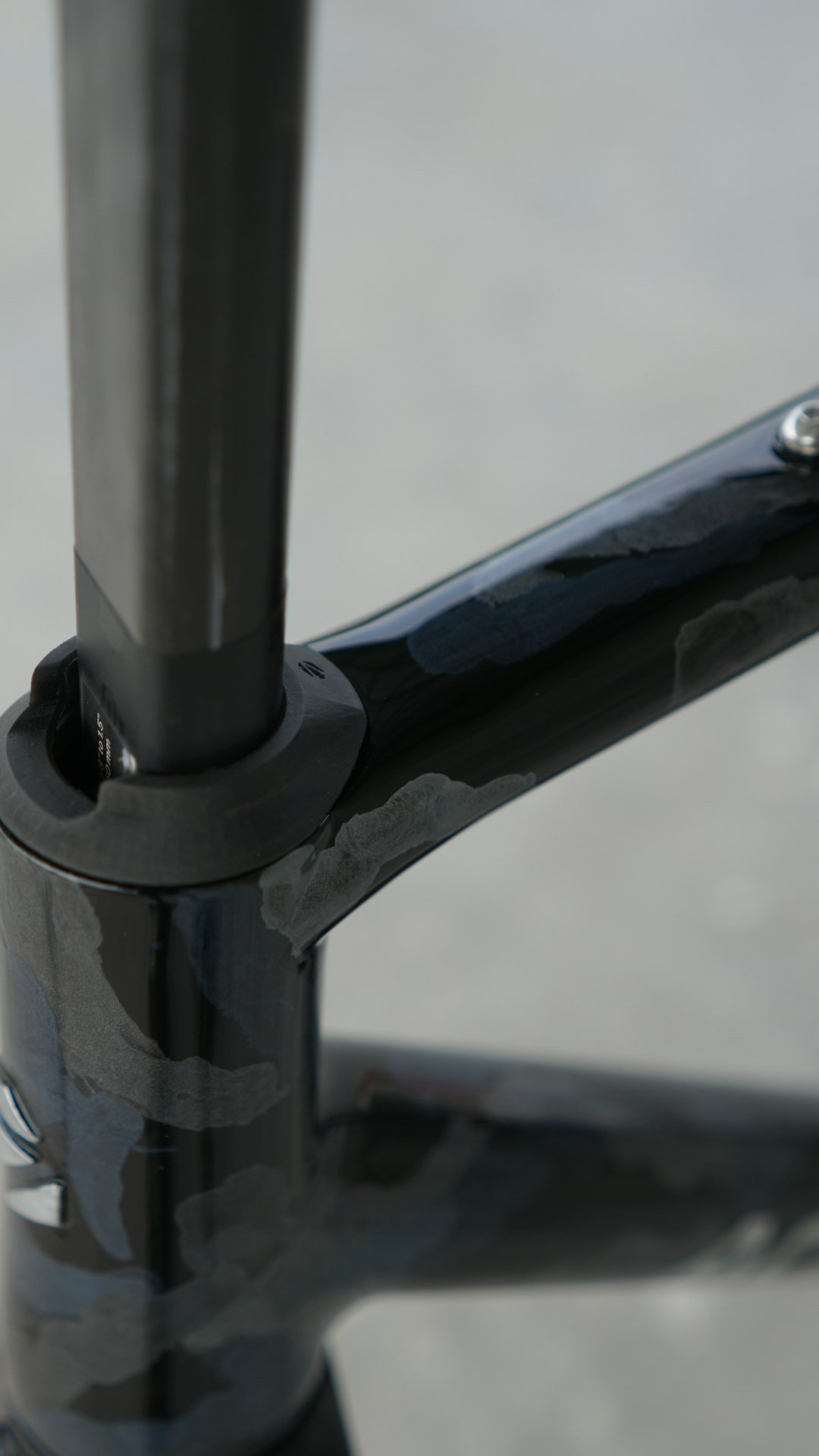 Part of a bicycle frame with damage.