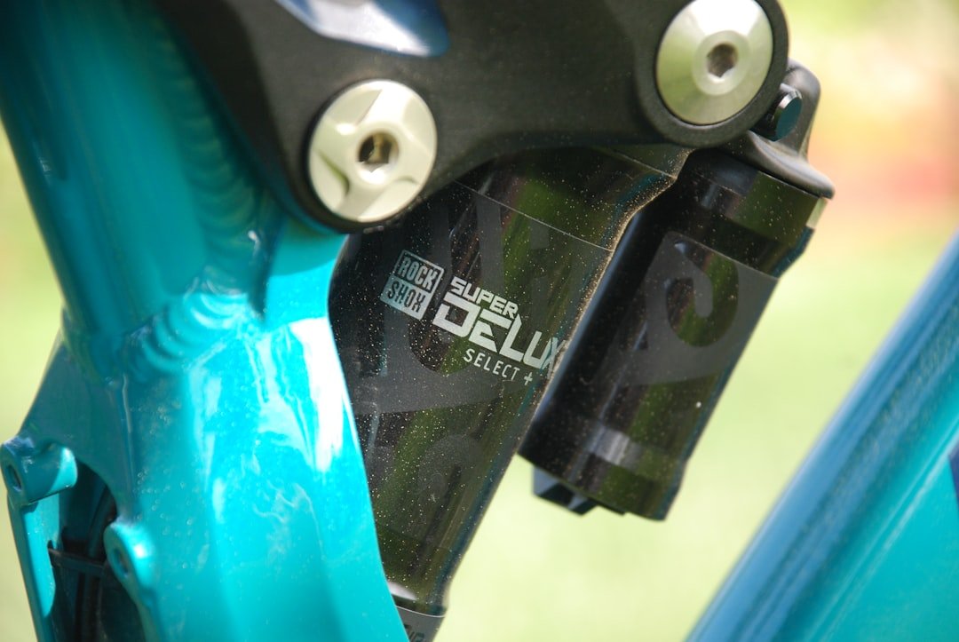 a close up of a bike handlebar with a blurry background