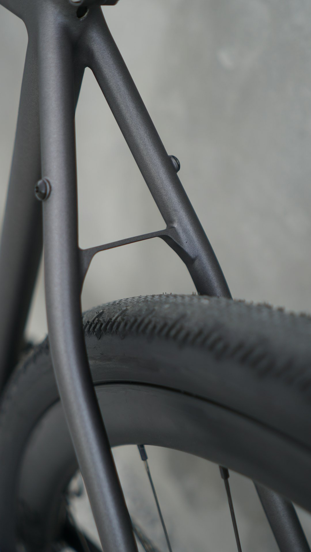 A close up of a bike tire and spokes