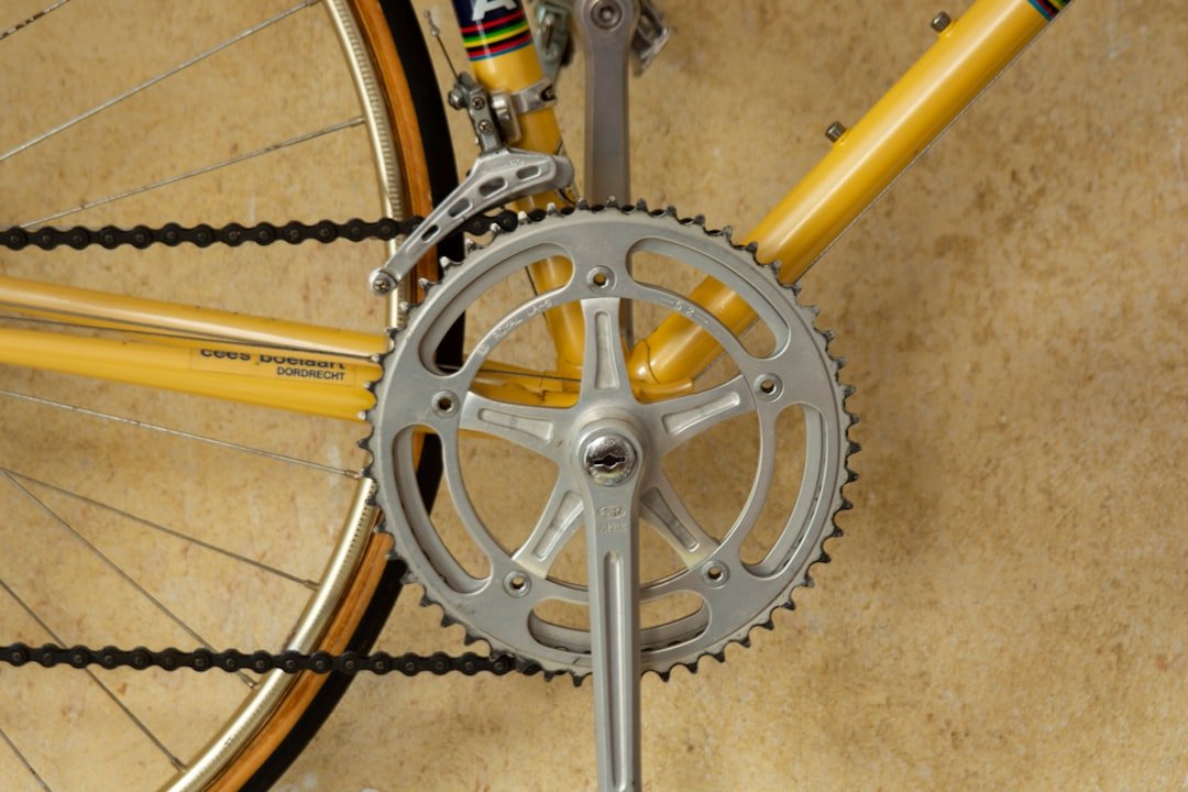 yellow bicycle with grey pedal sprocket