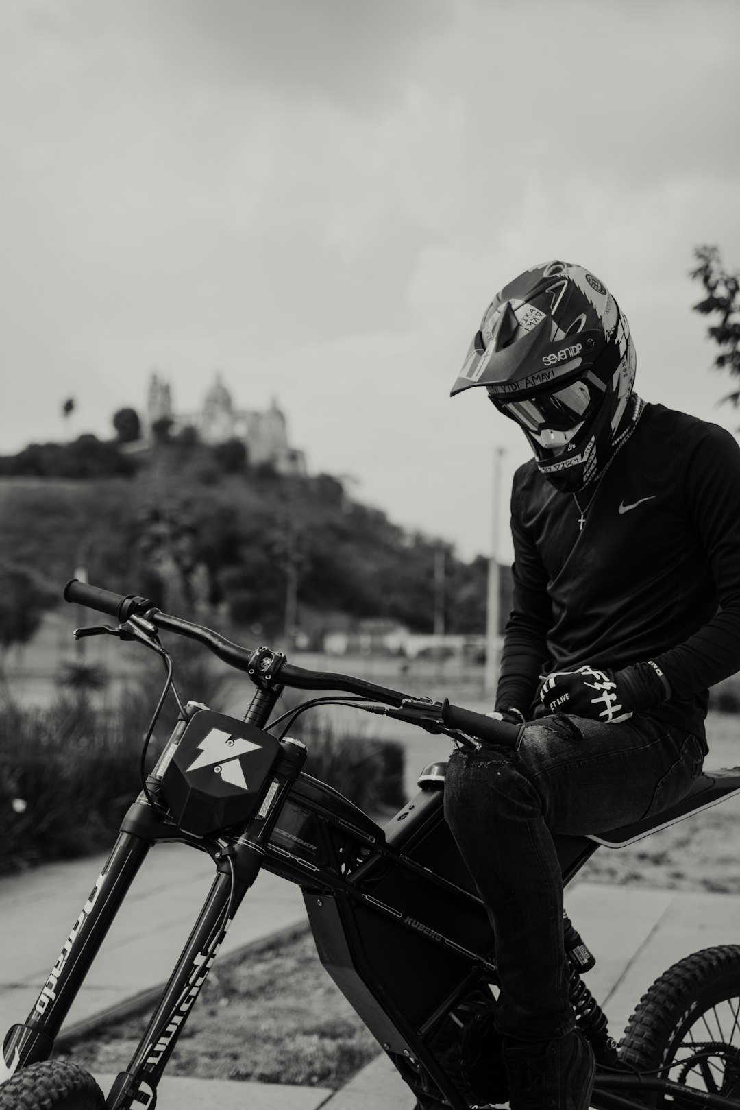 a man sitting on top of a dirt bike