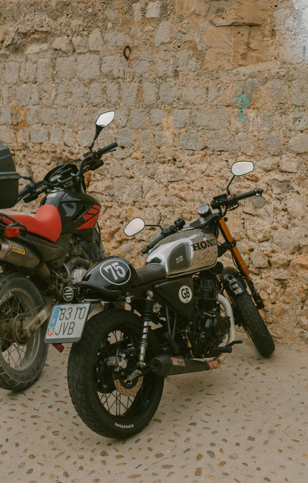 A couple of motorcycles parked next to each other