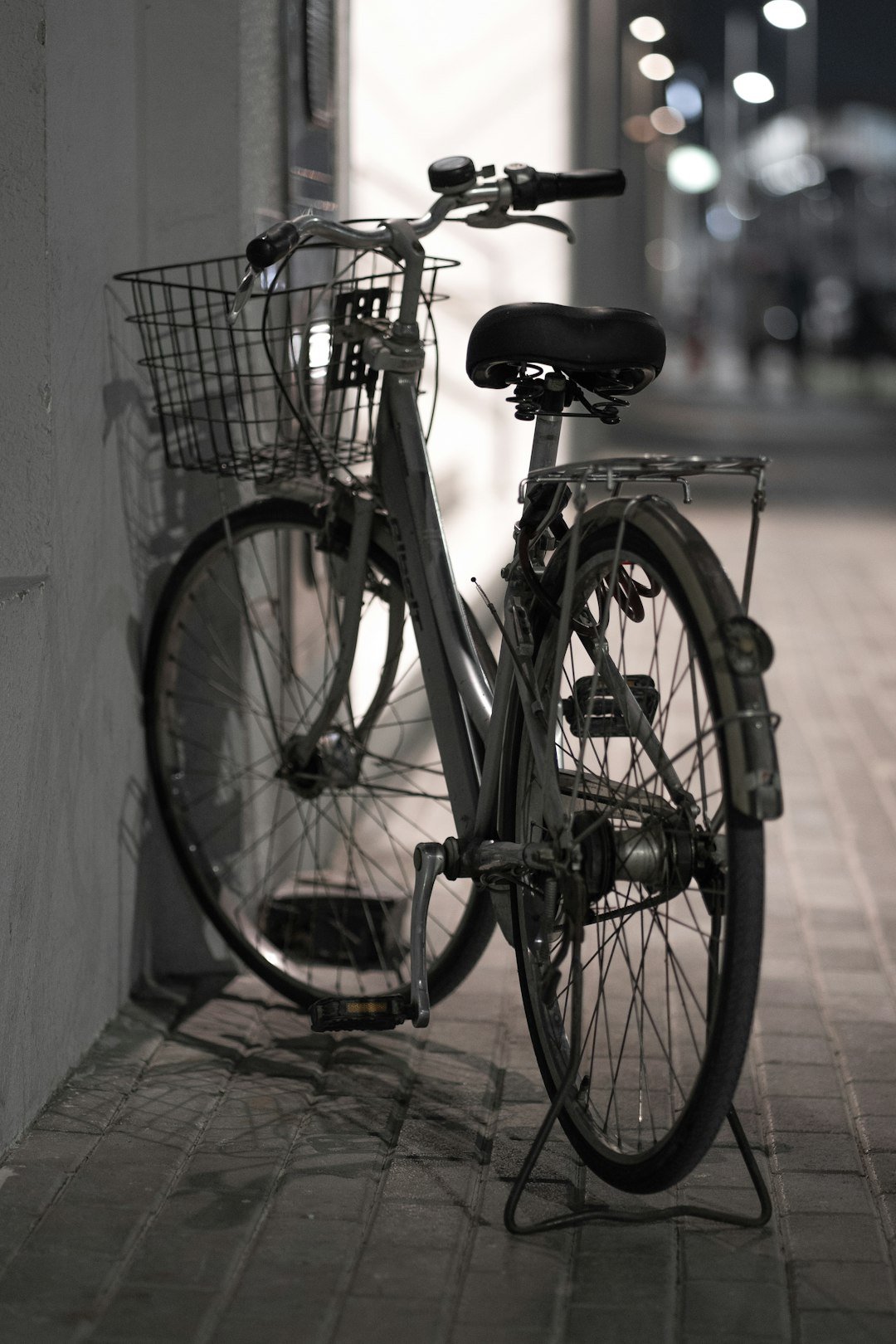 A bicycle parked on the side of a building