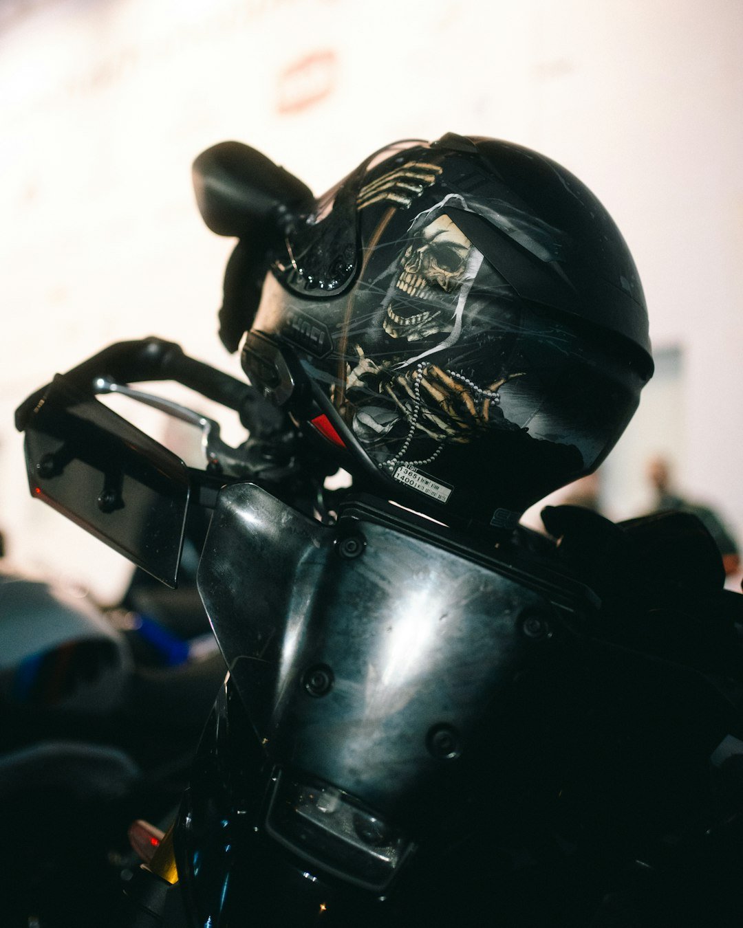 Black motorcycle helmet with grim reaper design