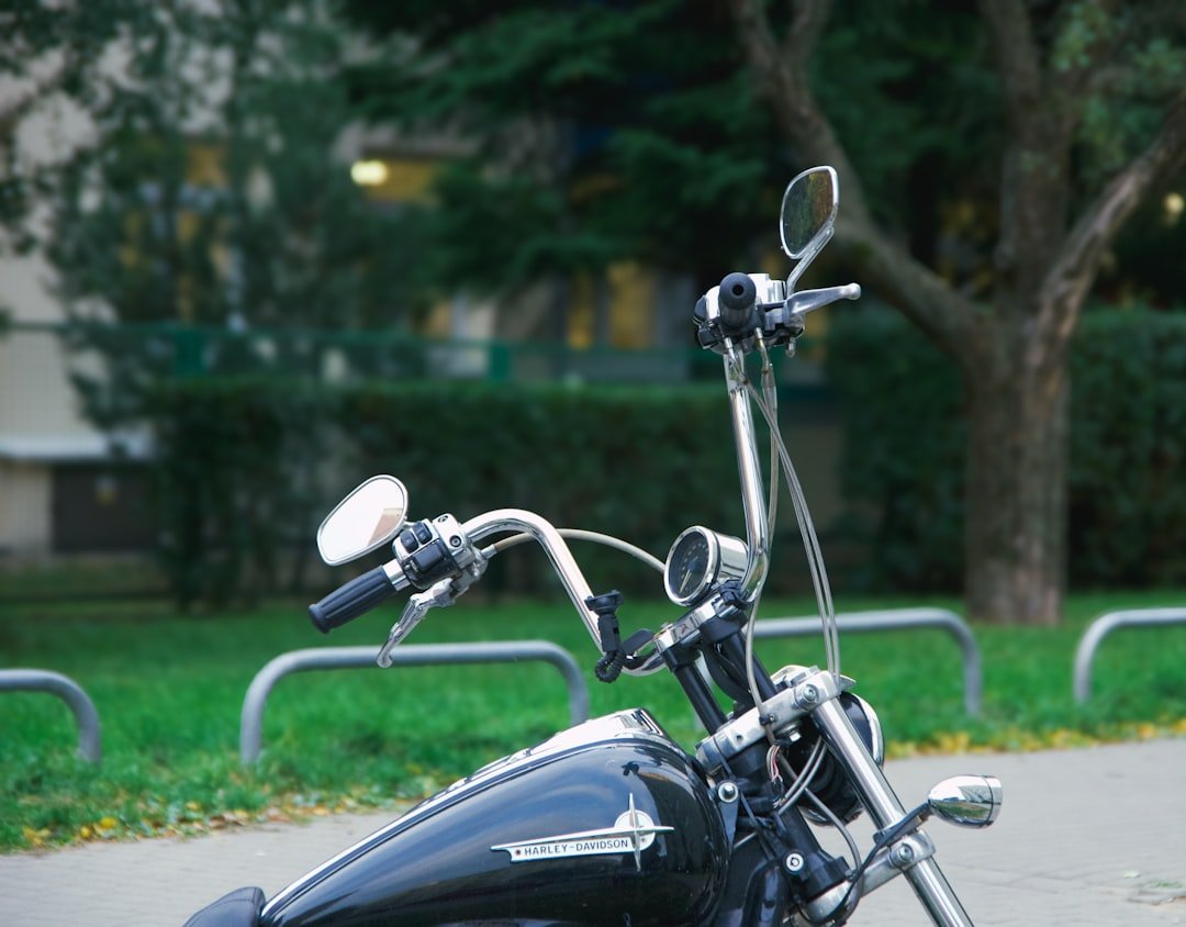 a black motorcycle parked on the side of a road