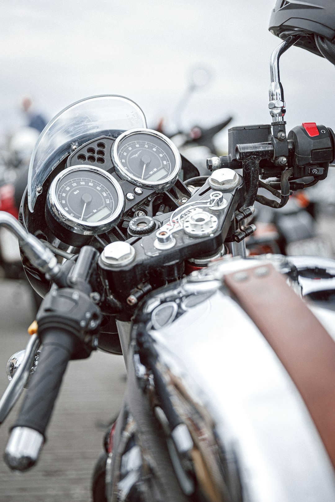 Close-up of a vintage motorcycle's handlebars and handlebars.
