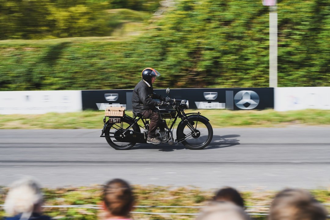 Man riding vintage motorcycle on a track