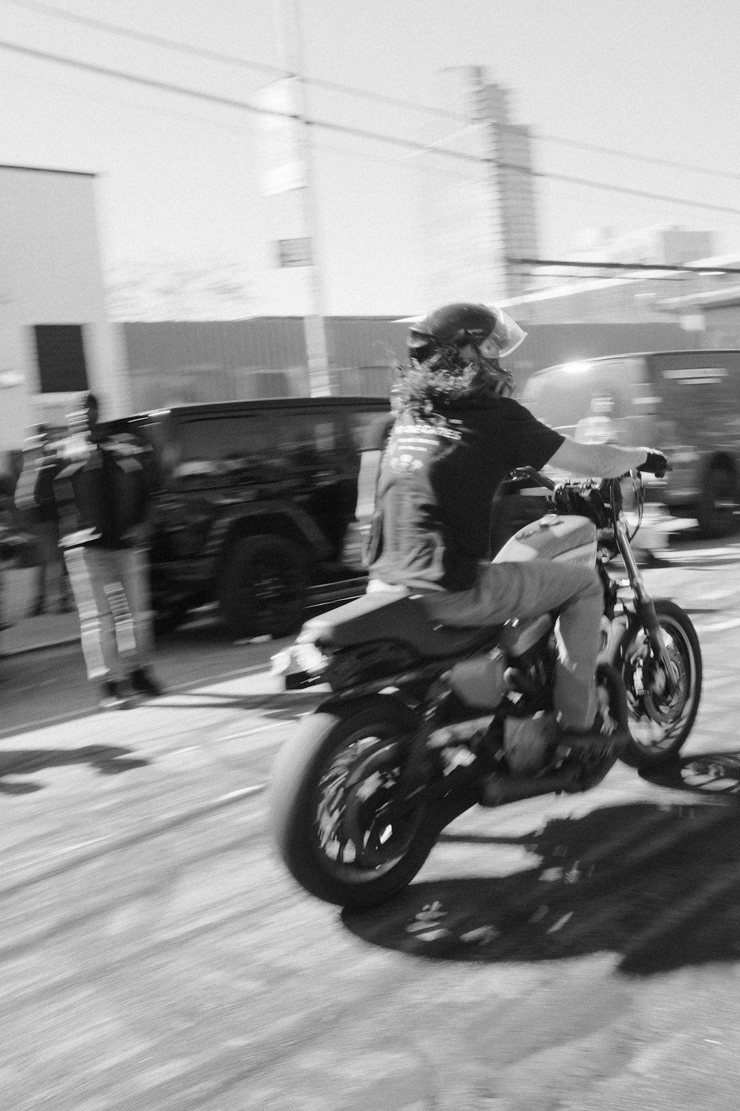 Person riding a motorcycle with motion blur
