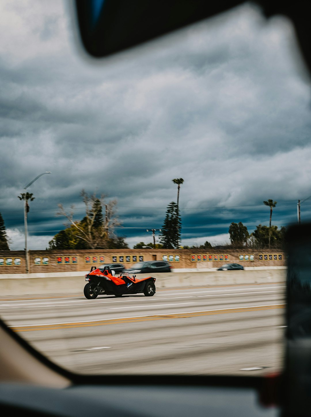 red and black f 1 car on road during daytime