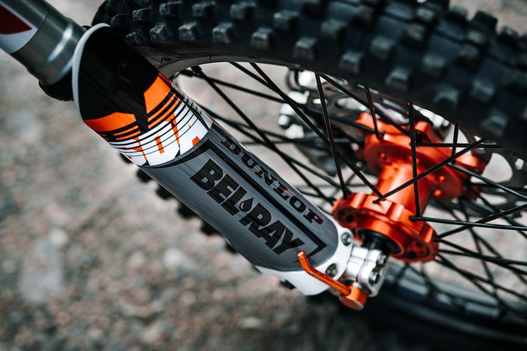 orange and black bicycle wheel