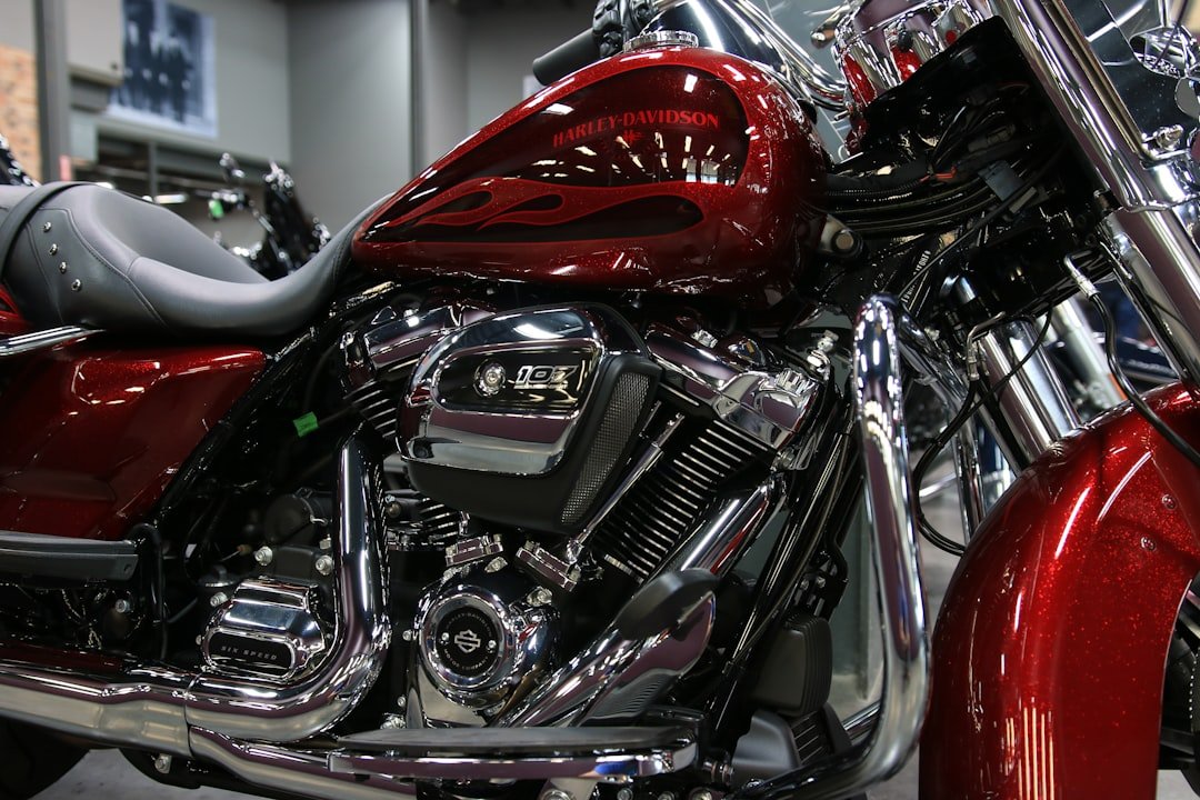 a red motorcycle is parked in a showroom