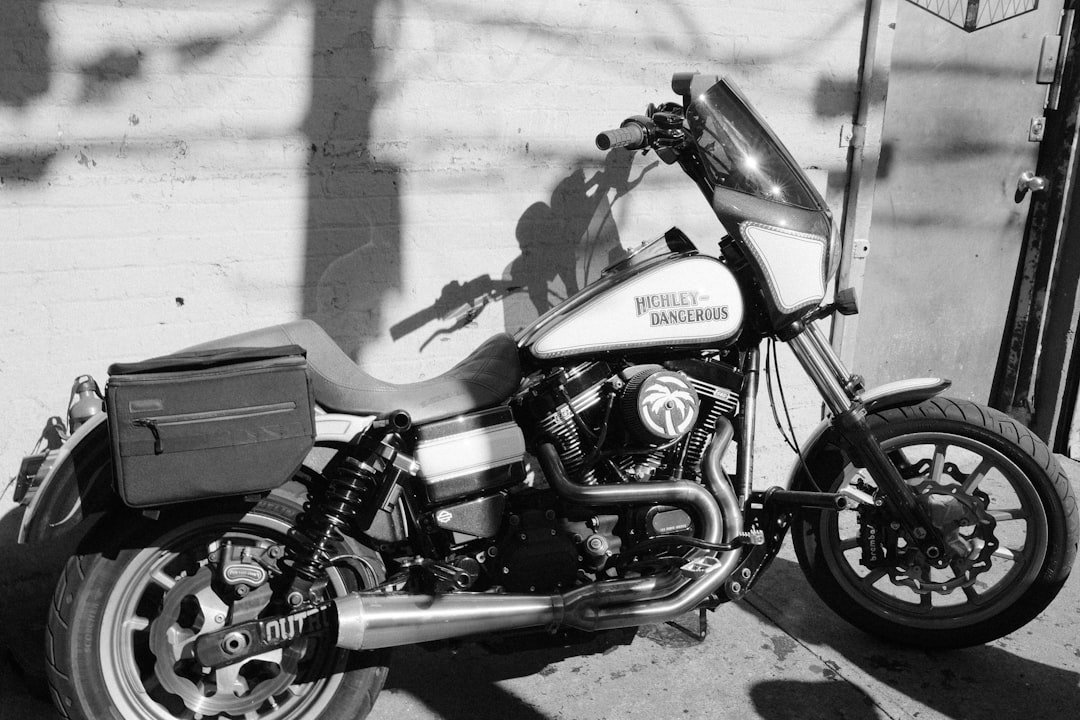 White motorcycle parked against a wall