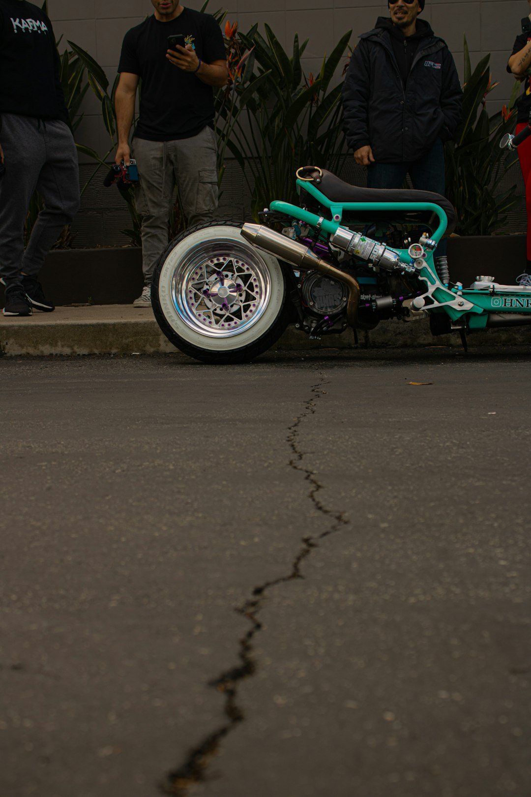 a small motorcycle parked on the side of the road