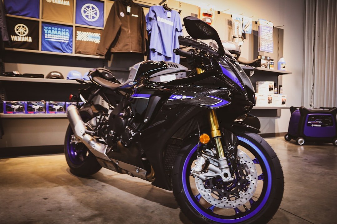 A black and blue sport motorcycle on display.