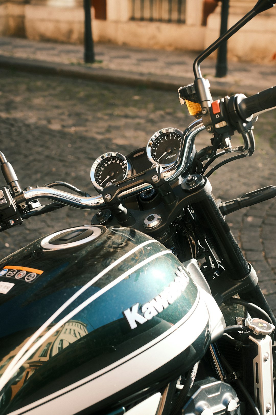 Close-up of a black kawasaki motorcycle handlebars