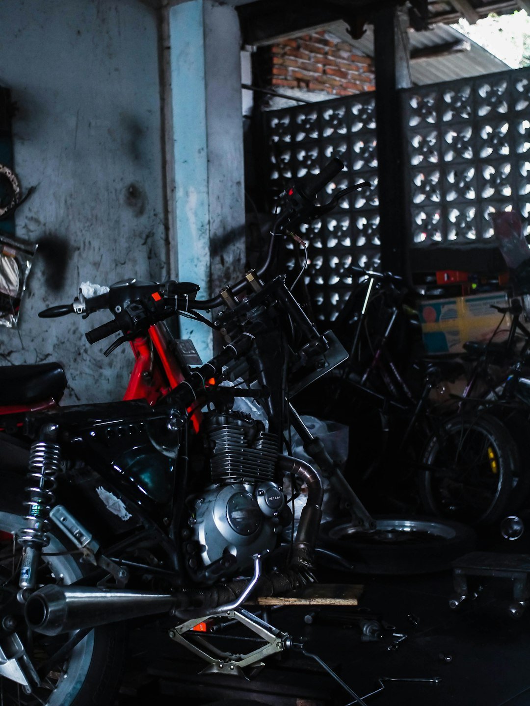 Motorcycle frame being worked on in a garage.