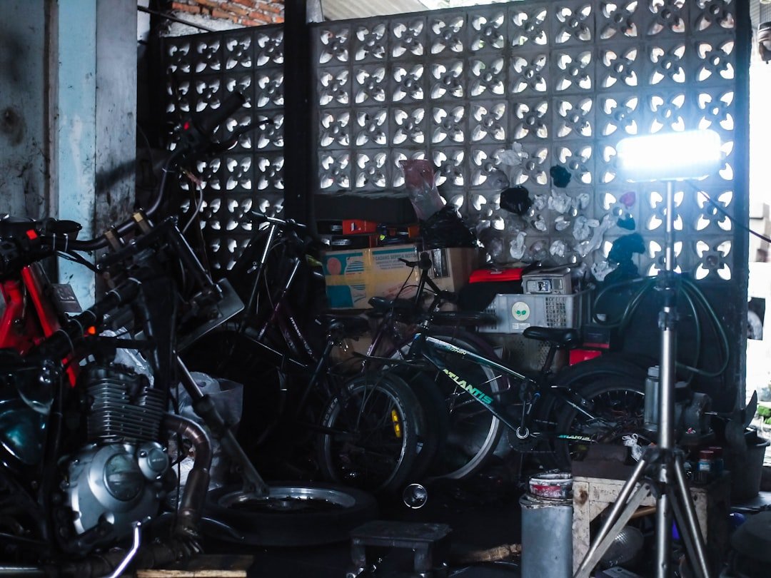 Pile of disassembled motorcycle parts in a workshop