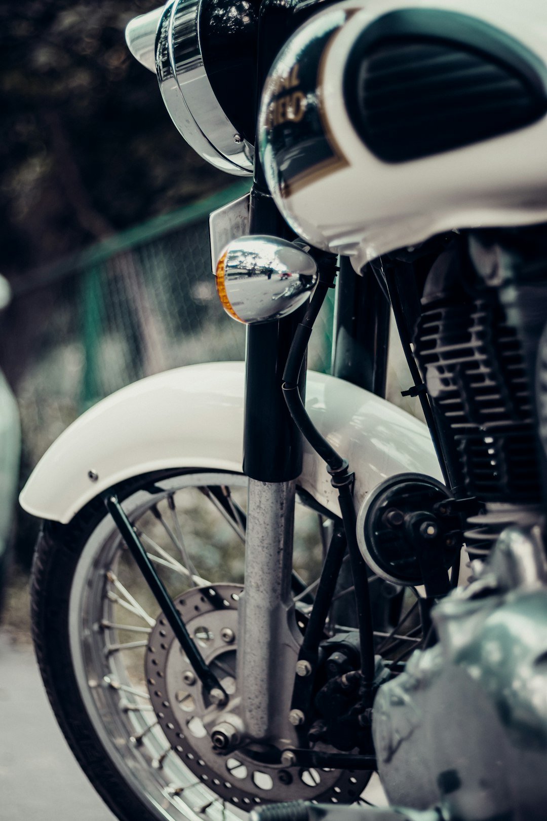 white and black motorcycle with white and yellow round container