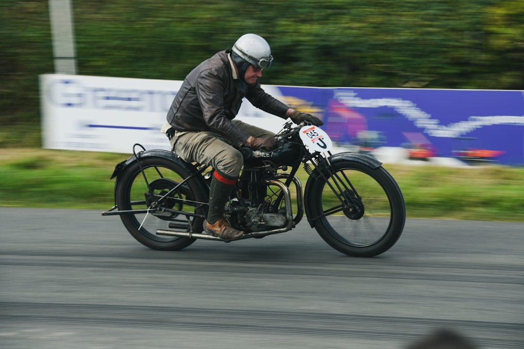 Man riding vintage motorcycle on a track