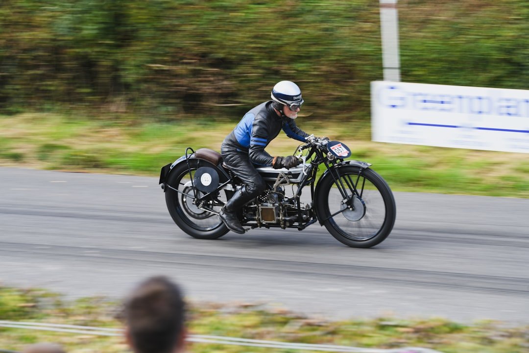 Man riding vintage motorcycle on a track