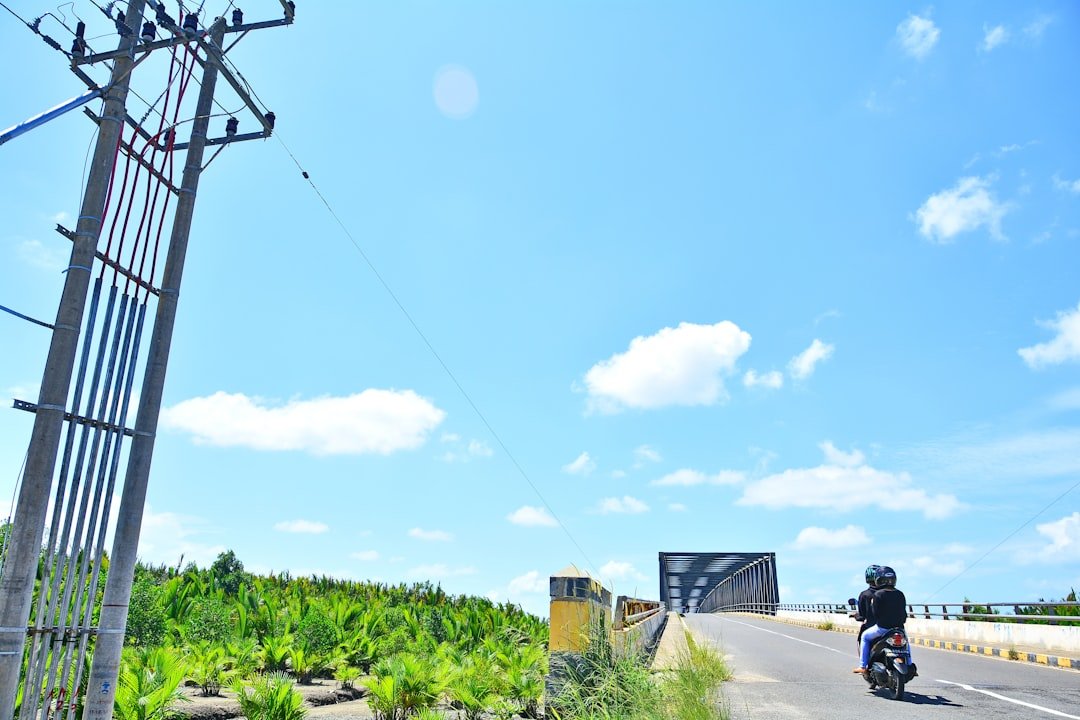 a person riding a motorcycle on a road