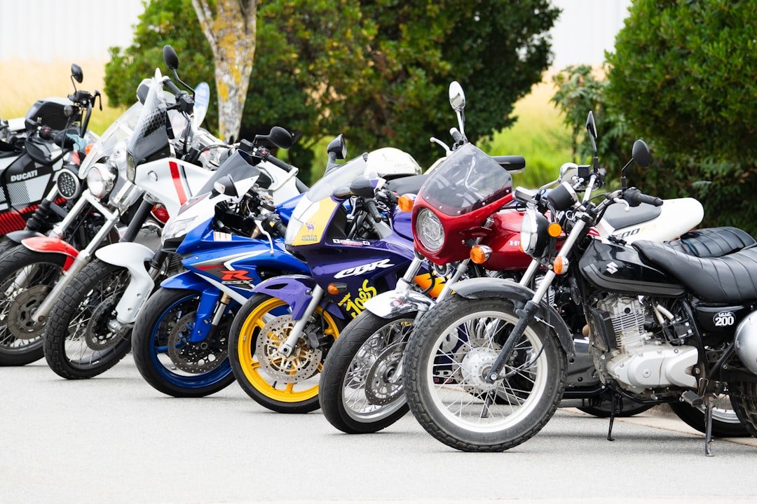 A row of colorful motorcycles parked outside.