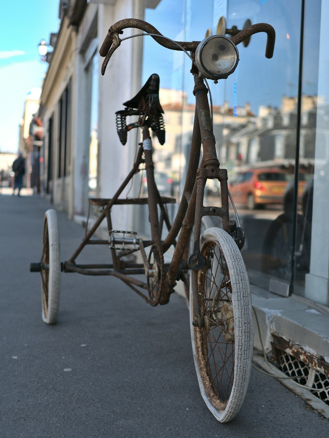 black and gray trike on gray asphalt road during daytime
