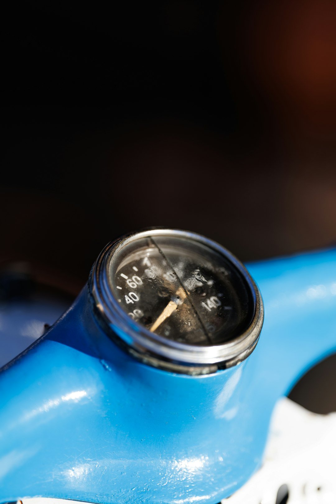 Close-up of a vintage motorcycle speedometer