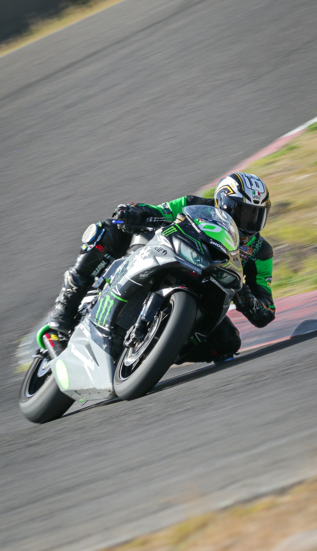 a person riding a motorcycle on a race track