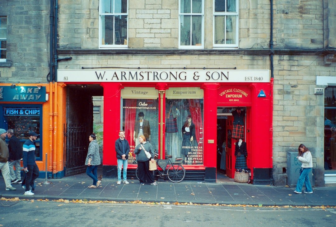 People standing outside w. armstrong & son shop.