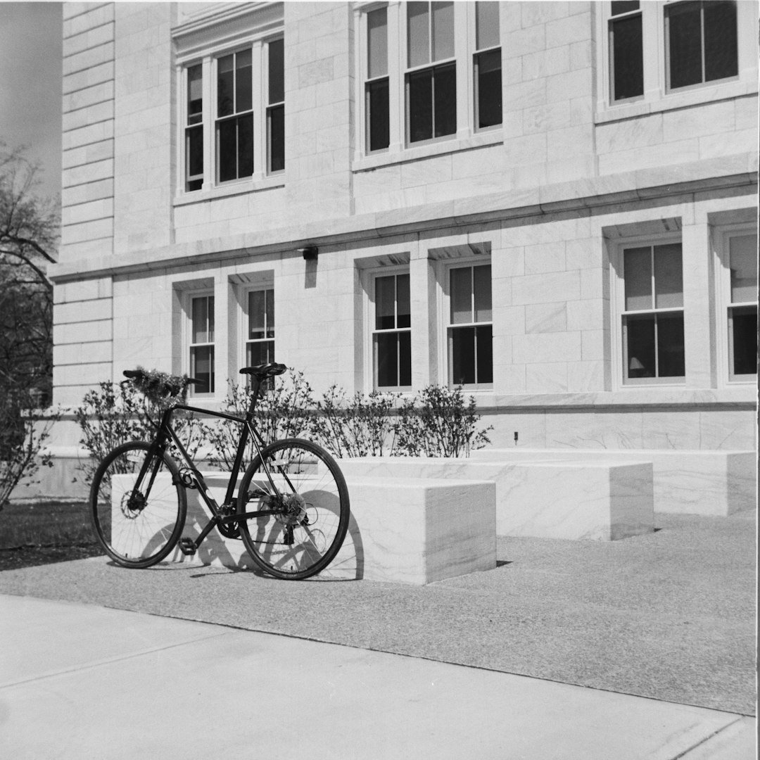A bicycle is parked in front of a building
