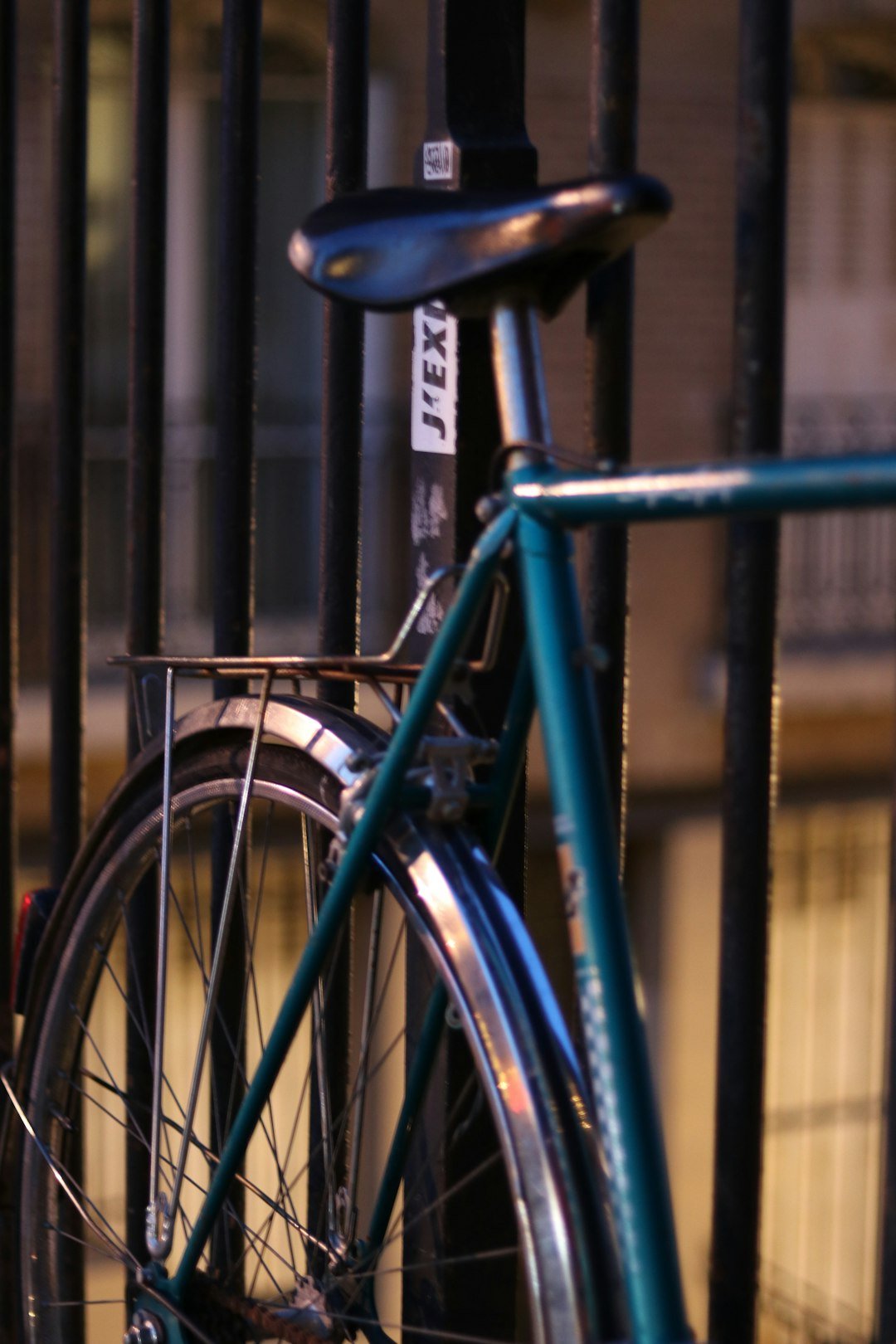 a bicycle is parked in a fenced in area