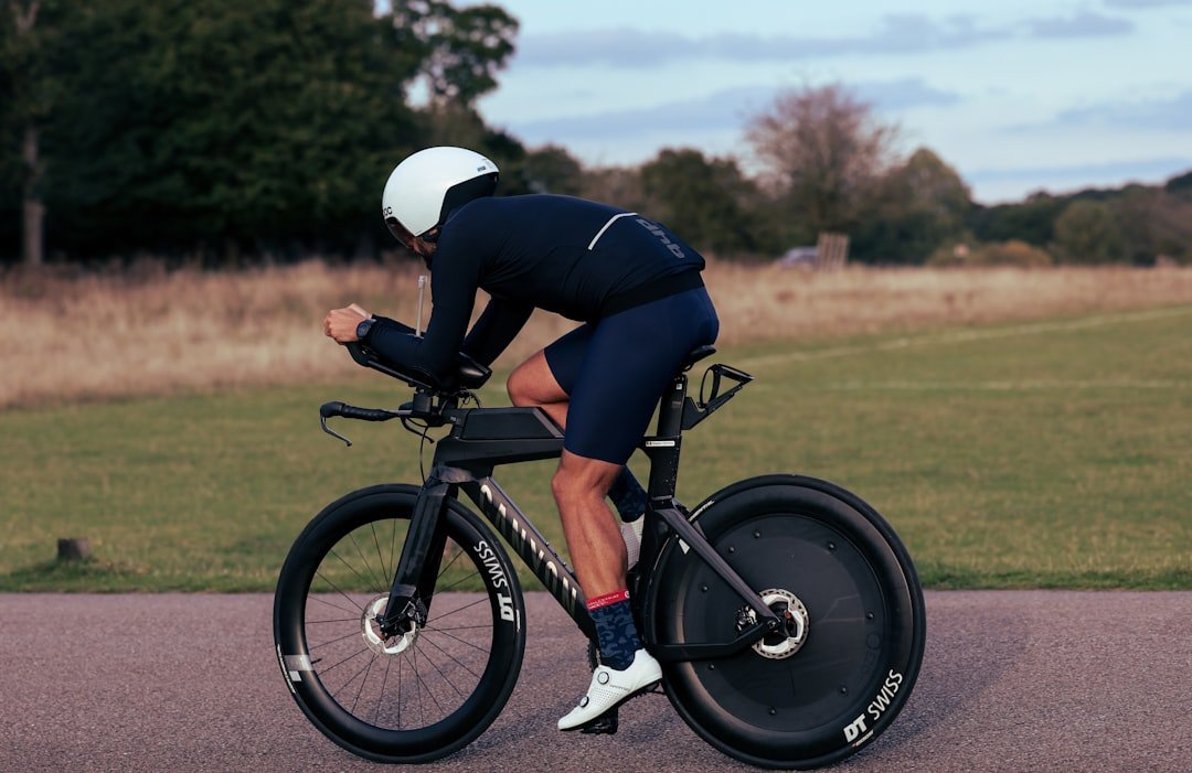 A man riding a bike down a curvy road
