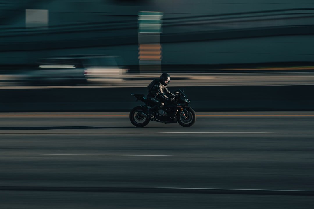 a person riding a motorcycle on a city street