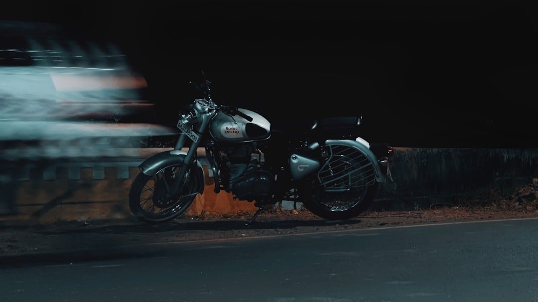 A motorcycle parked on the side of the road