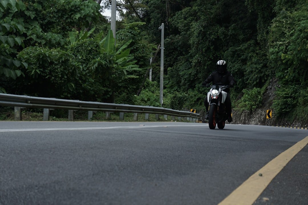 Rider on motorcycle on a winding road