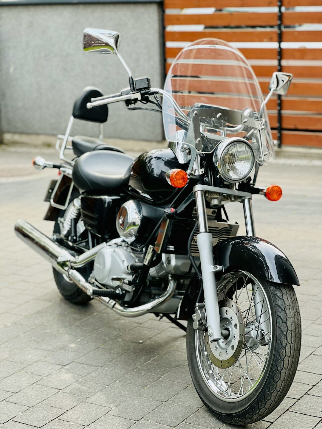 a motorcycle parked on a sidewalk