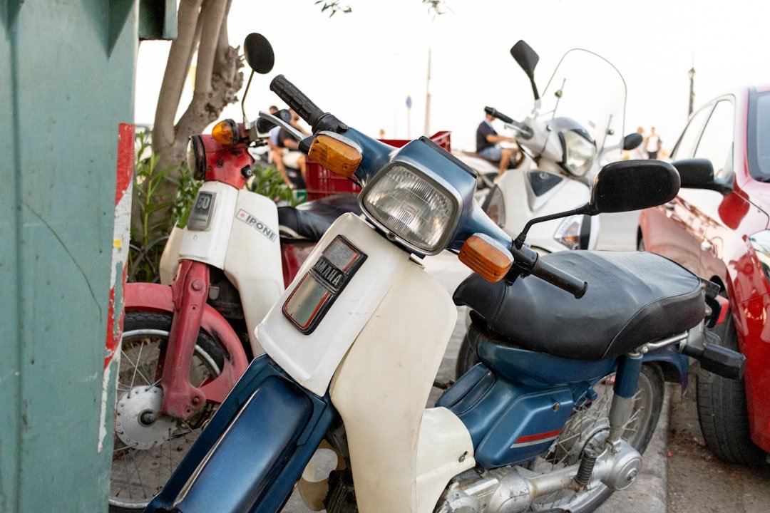 A row of motorcycles parked next to each other