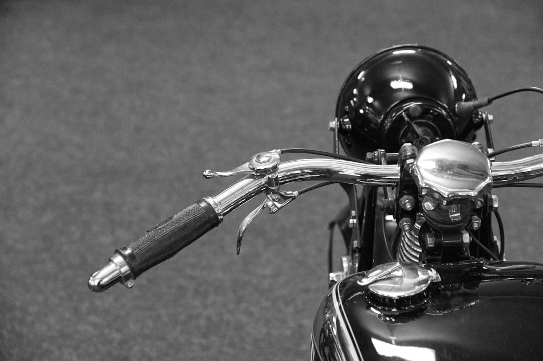 Close-up of vintage motorcycle handlebars and headlight