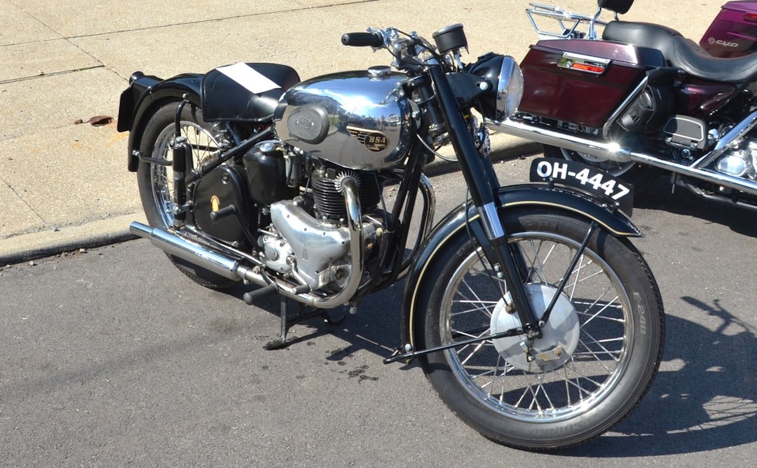 Classic black motorcycle with chrome details parked outdoors