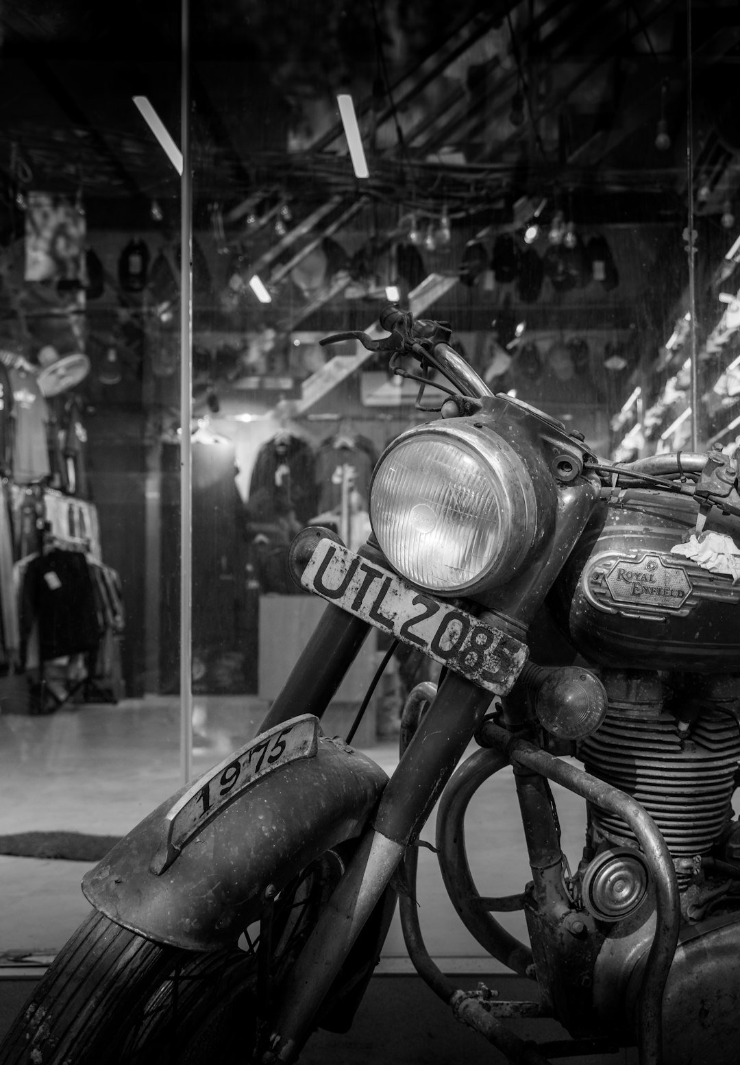 Vintage motorcycle with license plate in black and white.