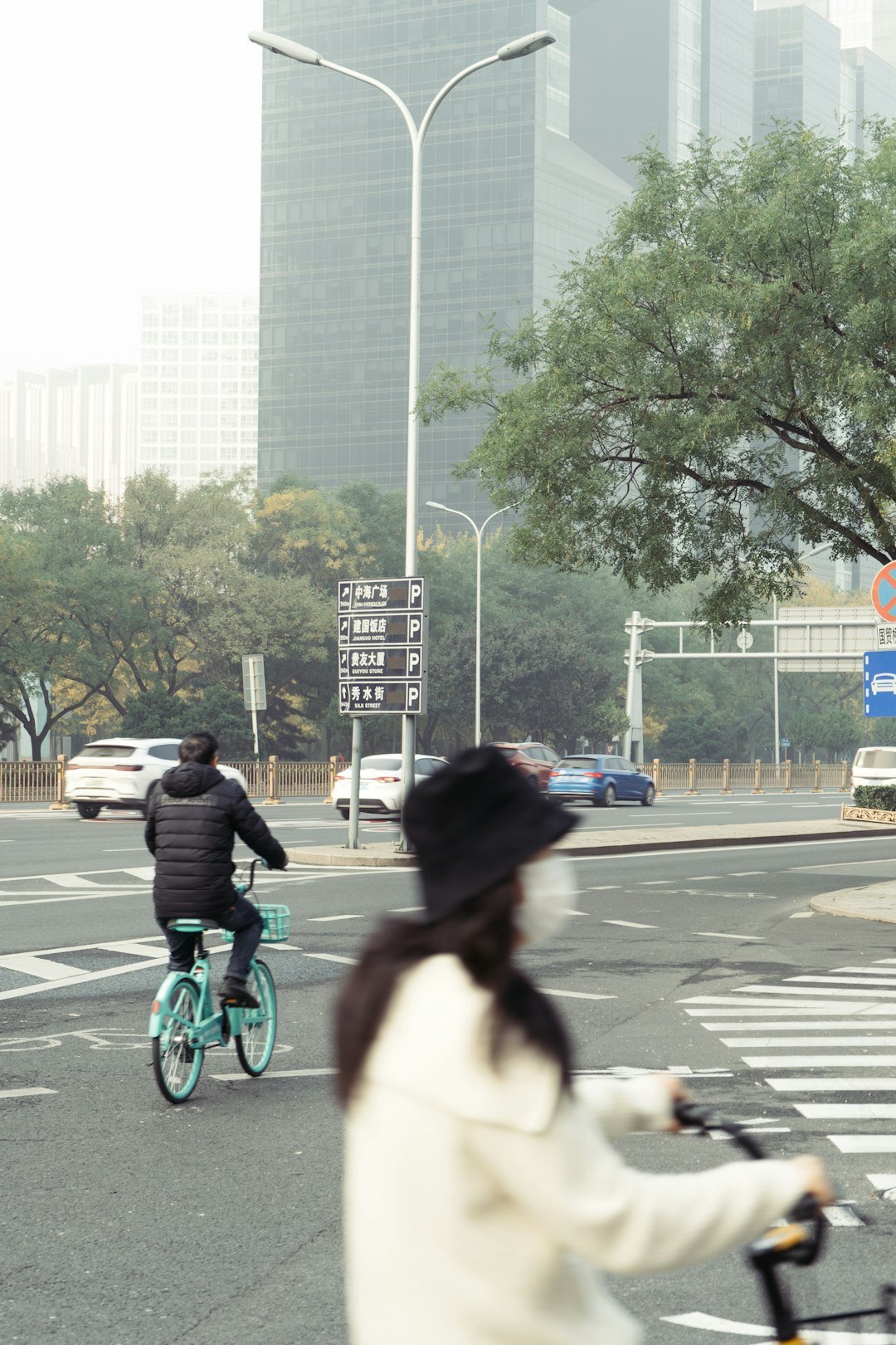 A person riding a bike on a city street
