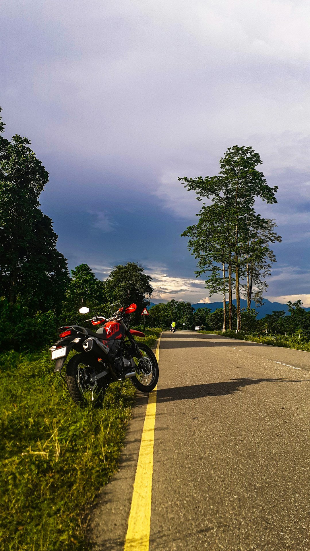 a motorcycle parked on the side of a road