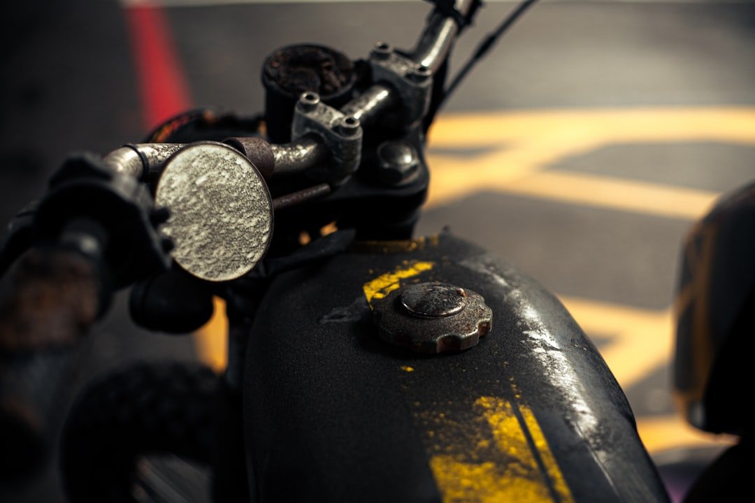 A close up of a bike handlebar with a blurry background