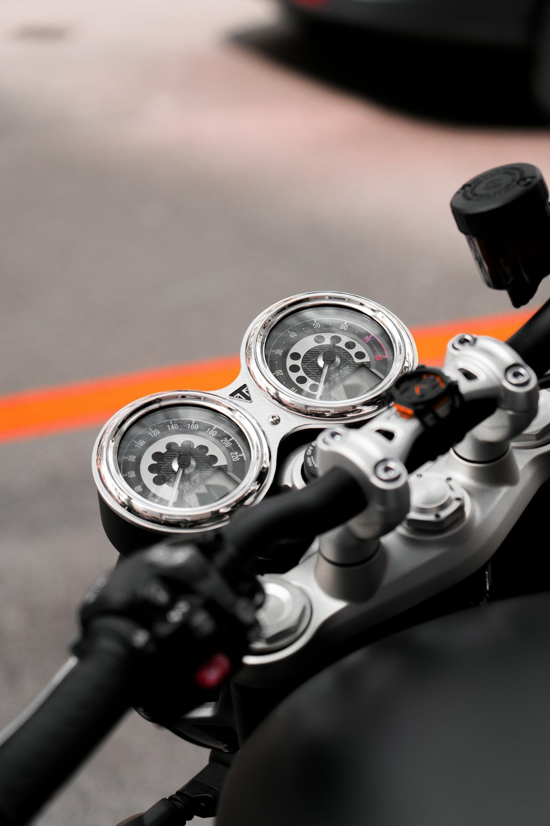 A close up of a motorcycle with a speedometer